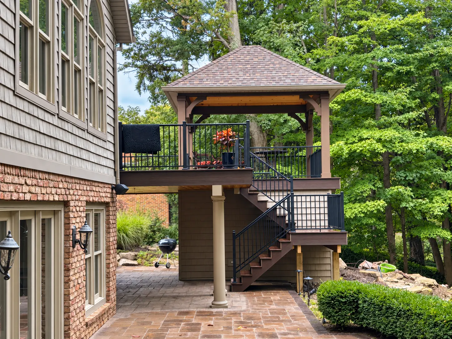 Sample pergola, broad deck steps and refined hardscaping